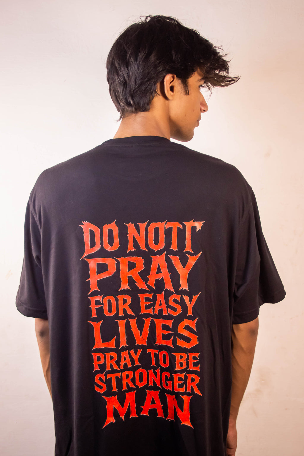 Men’s Tee Featuring the Quote – “Don’t Pray for Easy Lives, Pray to Be Stronger Men”