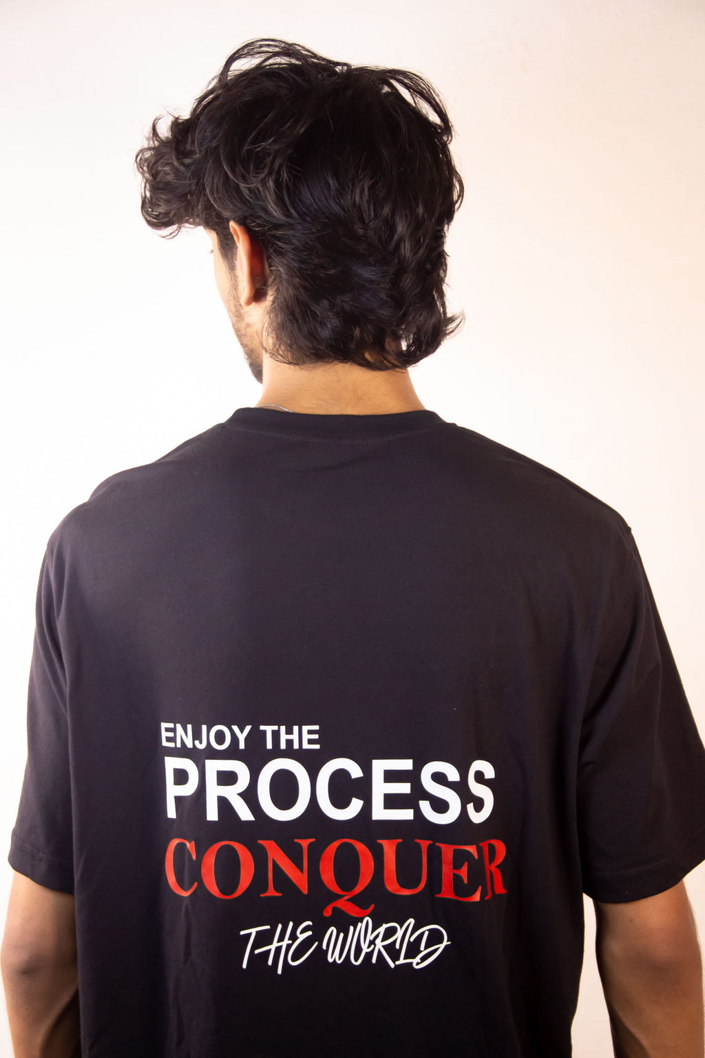 Men’s Tee Featuring the Quote – “Enjoy the Process, Conquer the World”