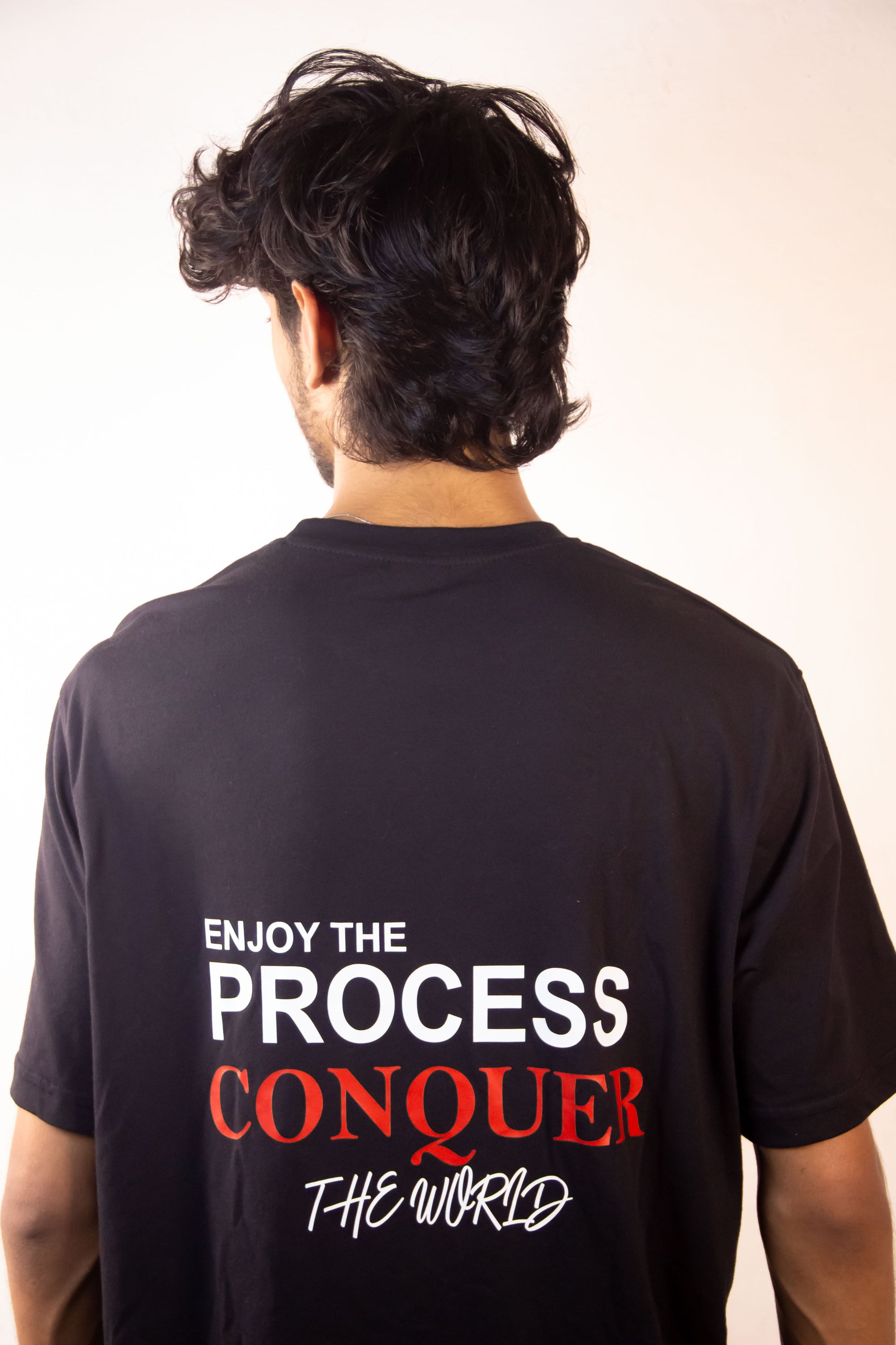 Men’s Tee Featuring the Quote – “Enjoy the Process, Conquer the World”
